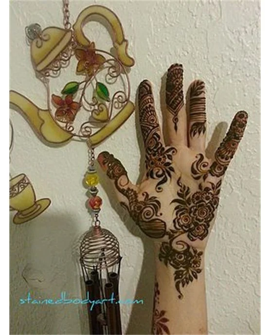 Contemporary Tendril With Chain Covering Front Hand Mehndi Design